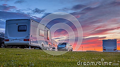 Caravans and cars sunset Stock Photo