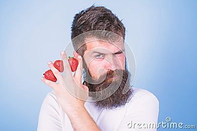Carbohydrate content strawberry. Metabolic disease. Strawberries safest fruit for sugar levels. Man beard hipster Stock Photo