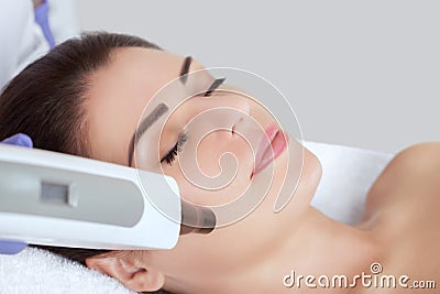 Carbon face peeling procedure in a beauty salon. Stock Photo