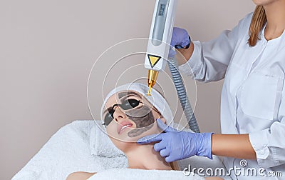 Carbon face peeling procedure in a beauty salon. Hardware cosmetology treatment Stock Photo