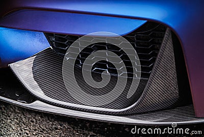 Carbon front spoiler on BMW M3 F80 Sport Car wrapped in blue vinyl on Drift And Cars Show Editorial Stock Photo