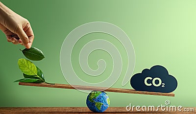 Carbon Neutral and ESG Concepts. Carbon Emission, Clean Energy. Globe Balancing between a Green leaf and CO2. Sustainable Stock Photo