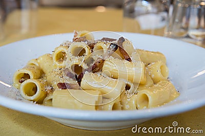 carbonara is Rigatoni alla carbonara is a specialty dish from lazio region and Roma sorround Stock Photo