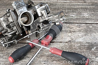 Carburetor and screwdrivers Stock Photo