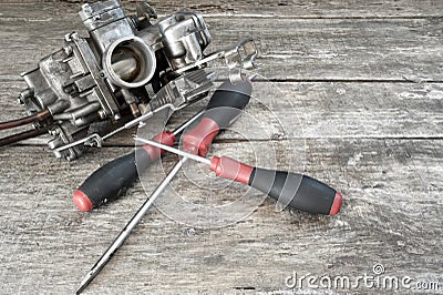 Carburetor and screwdrivers Stock Photo