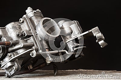 Carburetor on wooden surface Stock Photo