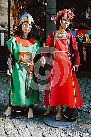 Dolls dressed in medieval clothes in the historic centre of Carcassonne, a hilltop town in southern France Editorial Stock Photo