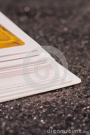 Card Collection: Side View of a Towering Stack of Cards Stock Photo