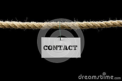 Card with Contact text hanging by wire from a rope isolated on b Stock Photo