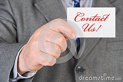 Card Contact us in hand Stock Photo