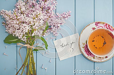 Card, english black tea and blooming lilac Stock Photo