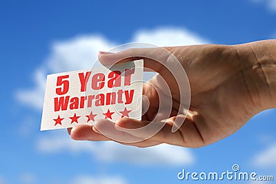 Card with five year warranty inscription Stock Photo