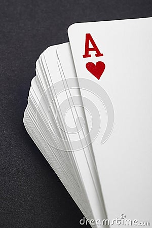 Card game with ace of hearts detail. Black background Stock Photo