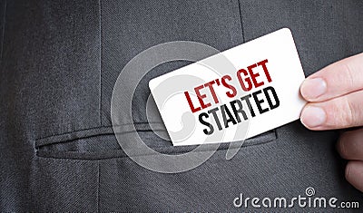 Card with LET'S GET STARTED text in pocket of businessman suit. Investment and decisions business concept Stock Photo