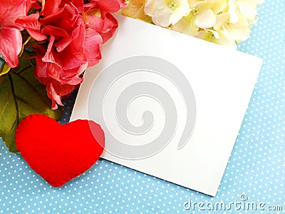 Card and red heart on blue polka dot background Stock Photo