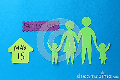 Card with text Family Day and paper cutouts on light blue background, flat lay Stock Photo