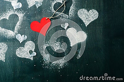 Card for Valentine's Day. Red paper heart on a rope. Stock Photo