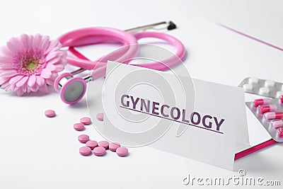Card with word Gynecology, pills, stethoscope and flower Stock Photo