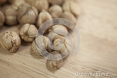 Cardamon Fruit on Wood Table Stock Photo