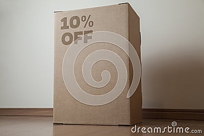 Cardboard box with 10% off order written on the box Stock Photo