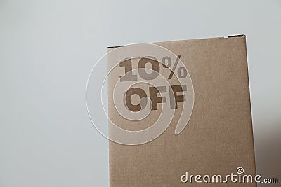 Cardboard box with 10% off order written on the box Stock Photo