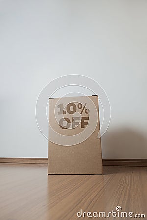 Cardboard box with 10% off order written on the box Stock Photo