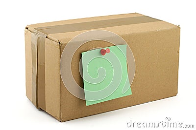 Cardboard box with pinned note Stock Photo