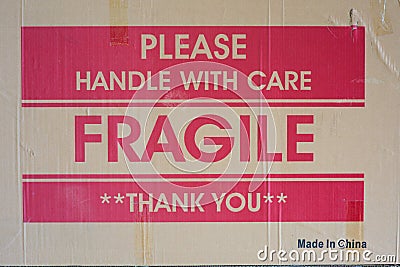Cardboard Box side with words of warning, Please Handle with Care, Fragile, and Thank You, printed in the center with Made in Chin Stock Photo