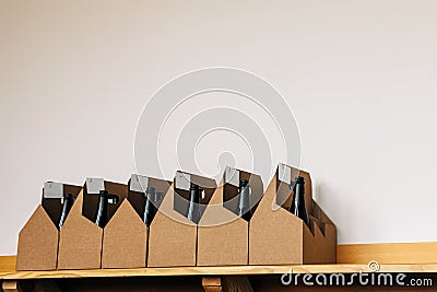 Cardboard boxes with bottles of wine in the wine store Stock Photo