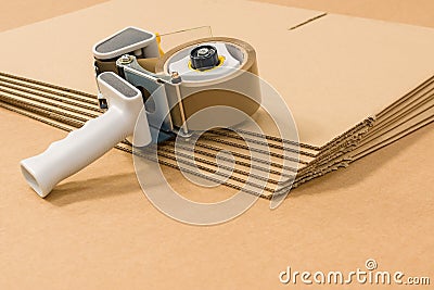 Cardboard Boxes and Tape Dispenser Stock Photo