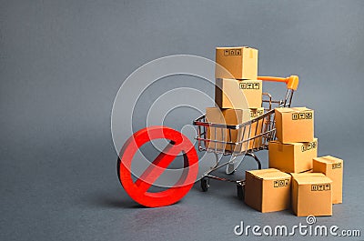 Cardboard boxes, supermarket trolley and red symbol NO. Embargo, trade wars. Restriction on the importation of goods, proprietary Stock Photo