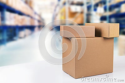 cardboard boxes on the table in warehouse with copy space Stock Photo