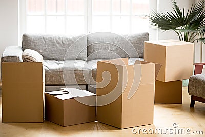 Cardboard carton boxes in living room, packing and moving concep Stock Photo