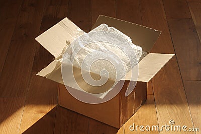 Cardboard Packing Box and Bubble Wrap Stock Photo