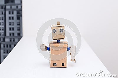 Cardboard robot arms on the white table at home Stock Photo