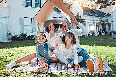 Cardboard roof, portrait and family relax on the lawn of new home, property or real estate, happy and excited. House Stock Photo