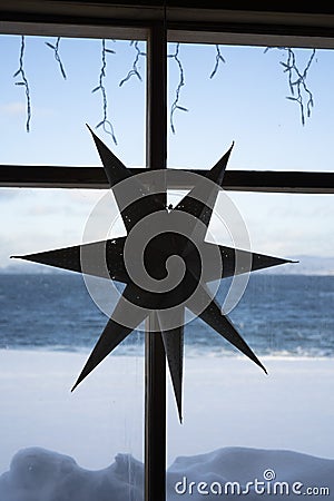 The cardboard seven-pointed star hang on the wooden Stock Photo