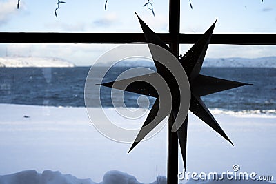 The cardboard seven-pointed star hang on the wooden Stock Photo
