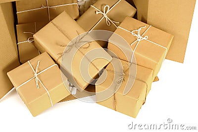 Cardboard shipping box with several brown paper packages or parcels inside Stock Photo