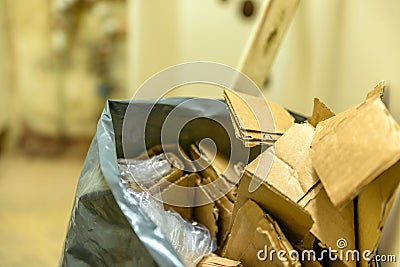 Cardboard waste in plastic bag on construction site Stock Photo