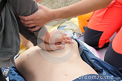 Cardiac massage and artificial respiration on a mannequin Editorial Stock Photo