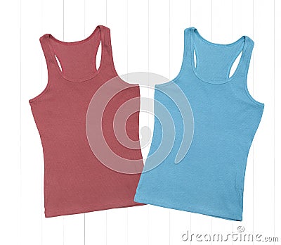 Cardinal red and pacific blue tank tops on white wooden background Stock Photo
