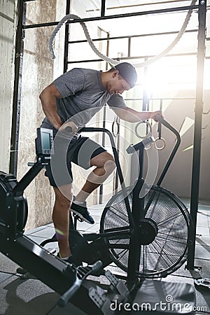 Cardio Workout. Sport Man Training On Bicycle, Cycling Exercise Stock Photo
