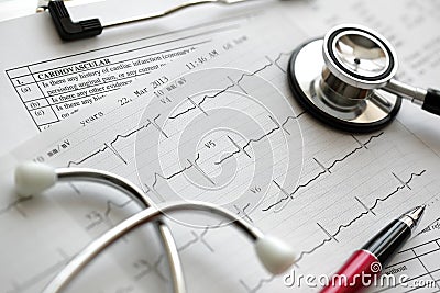 Cardiogram and stethoscope Stock Photo