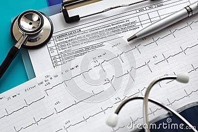 Cardiogram and stethoscope Stock Photo