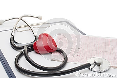 Cardiogram with stethoscope and red heart on table Stock Photo