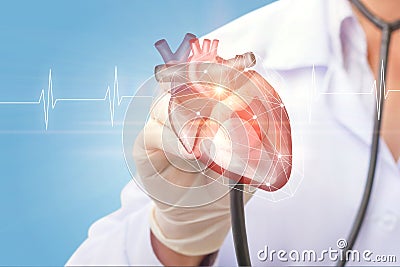 Cardiologist listens to the heart . Stock Photo