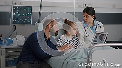 Cardiologist woman doctor discussing heart cardiogram explaining recovery treatment Stock Photo