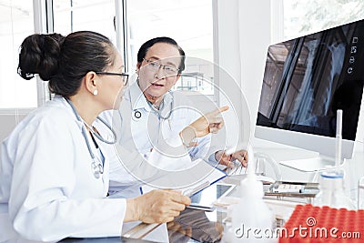 Cardiologists discussing difficult case Stock Photo