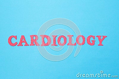 Cardiology word in red letters on a blue background. Concept of medicine section dealing with the treatment of heart diseases. Stock Photo